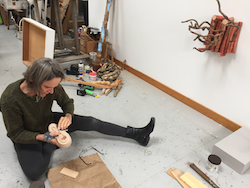 Provincetown sculptor Susan Lyman working in her studio.